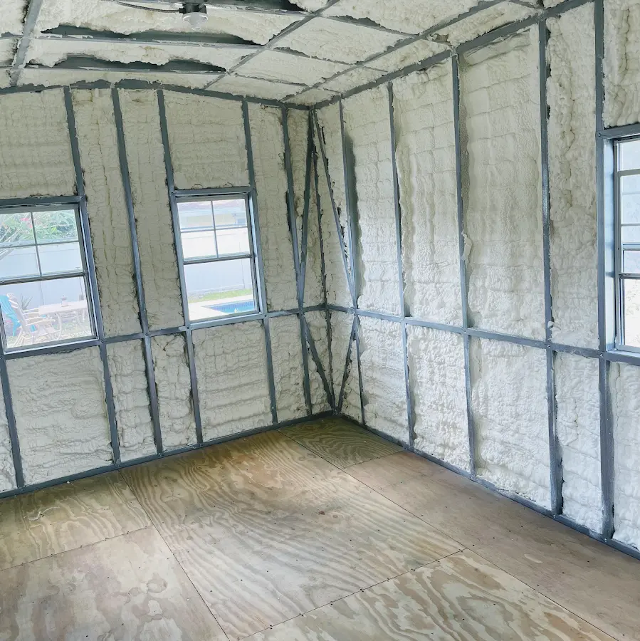 Closed-cell spray foam insulation applied to wall cavities in a residential project in Barling
